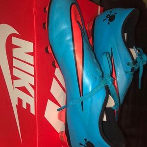 Nike soccer cleats and shin guards